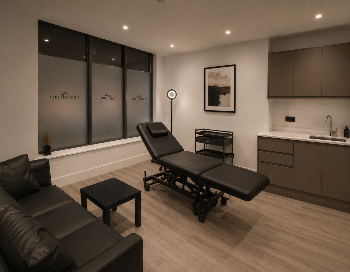 A minimalist clinical interior resembling ShoreRooms with soft neutral tones, high-end treatment chair, and sleek medical equipment. The space is illuminated with soft diffused lighting, emphasizing a clean, sterile yet welcoming atmosphere with light wood accents and white walls.